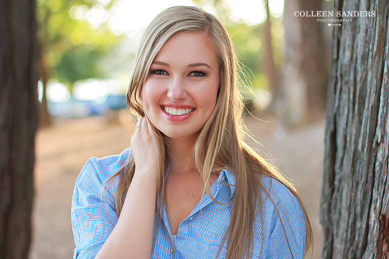 Classic high school senior portraits by the lake with natural greenery for my senior model by senior photographer Colleen Sanders near El Dorado Hills, California.