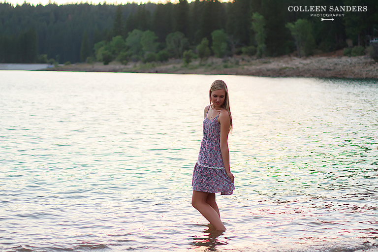 Classic high school senior portraits by the lake with natural greenery for my senior model by senior photographer Colleen Sanders near El Dorado Hills, California.