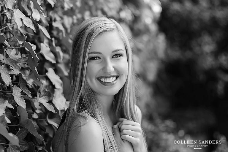 Classic high school senior portraits by the lake with natural greenery for my senior model by senior photographer Colleen Sanders near El Dorado Hills, California.