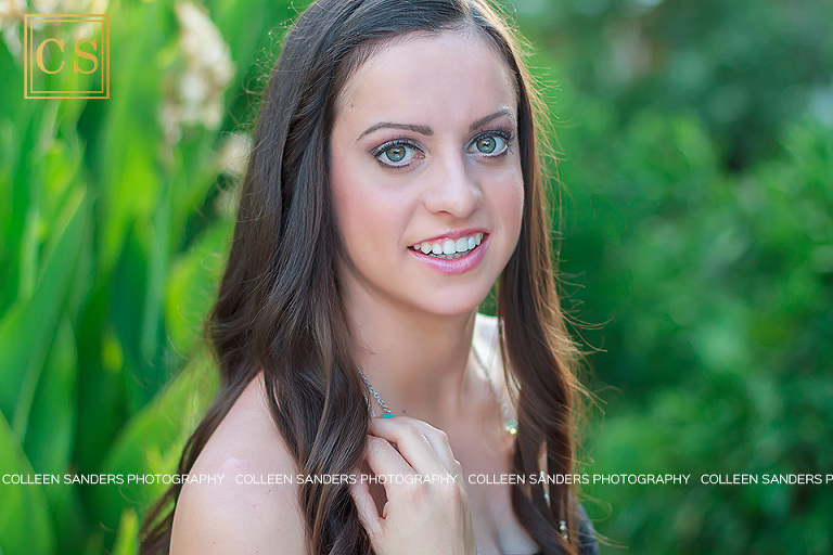 Nicole's senior pictures, with a close up in her black dress and yellow flowers behind her by El Dorado Hills senior photographer Colleen Sanders.
