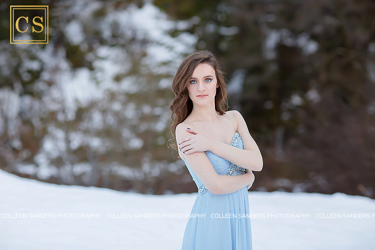Winter senior portraits in the snow with El Dorado Hills and Folsom Senior Photographer Colleen Sanders, featuring gorgeous blue prom dress.