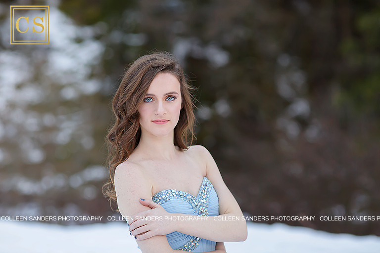 Winter senior portraits in the snow with El Dorado Hills and Folsom Senior Photographer Colleen Sanders, featuring gorgeous blue prom dress.