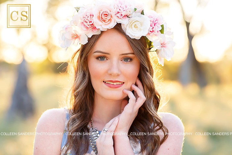 Spring senior pictures, oak trees, grass, blue dress, flower crowns, by El Dorado Hills senior photographer Colleen Sanders Photography.