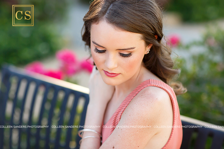 El Dorado Hills senior photographer Colleen Sanders shooting senior pictures for Oak Ridge Senior Lizzy in the El Dorado Hills Town center rose garden with her beautiful summer dress and makeup.