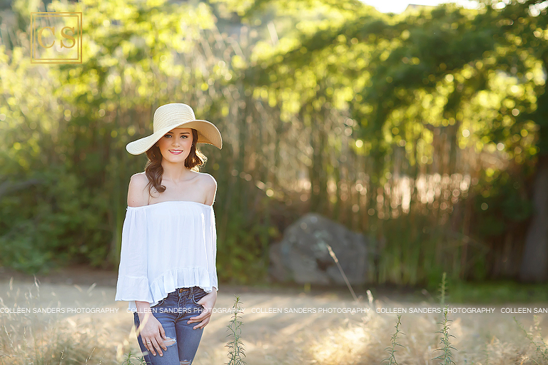 El Dorado Hills senior at Oak Ridge High School, natural greenery, with a hat, bridge, jeans and white shirt, girl, makeup. 