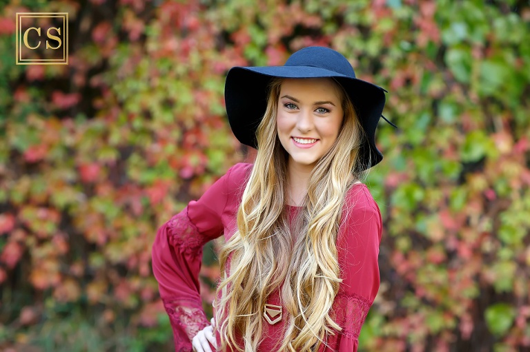 Colleen Sanders Photography senior pictures girl red dress, gold jewelry, hat, fall portraits. 
