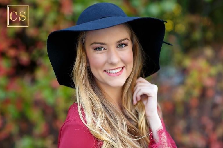 Colleen Sanders Photography senior pictures girl red dress, gold jewelry, hat, fall portraits close up, Oak Ridge High School.