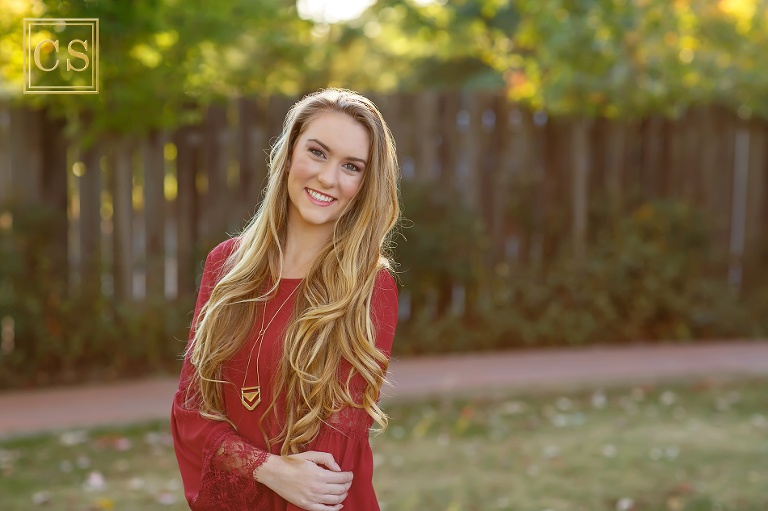 Colleen Sanders Photography senior pictures girl red dress, gold jewelry, hat, fall portraits, back light, lace.