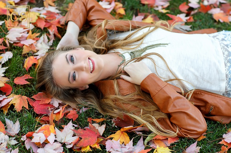 Colleen Sanders Photography senior pictures girl leaves, fall, lace, jacket closeup.