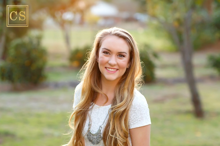 Colleen Sanders Photography senior pictures girl closeup, back light, greenery