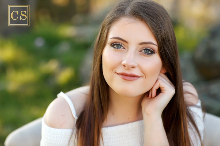 El Dorado Hills senior pictures with Colleen Sanders Photography, closeup of eyes and eyelashes, natural greenery, back light.