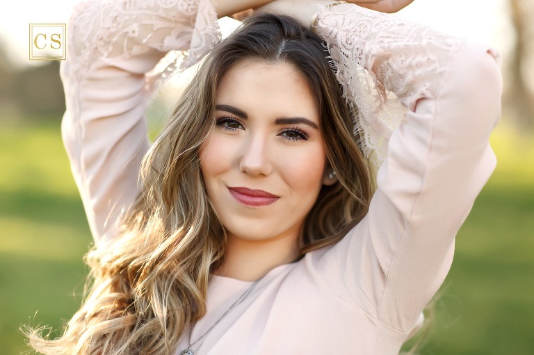 Senior girl with pink lace dress in El Dorado Hills by Colleen Sanders Photography.