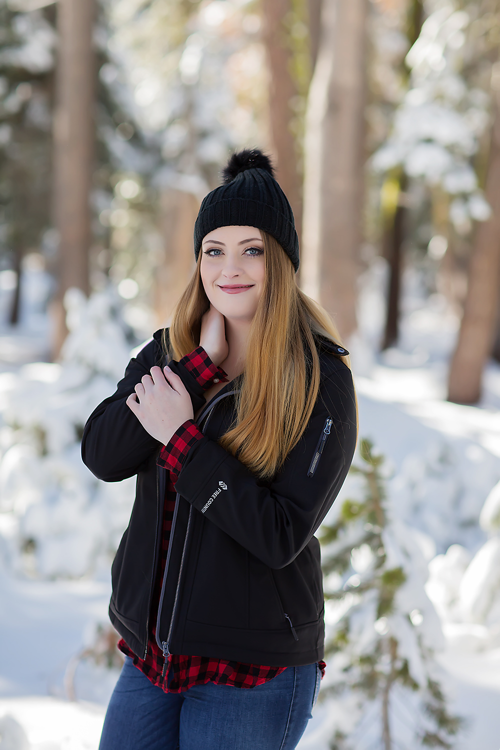 Senior session in snow, beanie, hat, cozy, winter wonderland by Colleen Sanders Photography in Tahoe, California.